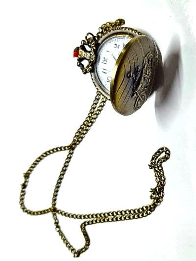 This brass pocket watch, a striking fusion of craftsmanship and legend, embodies the spirit of Ghost Rider with intricate details and a dark, enigmatic aura