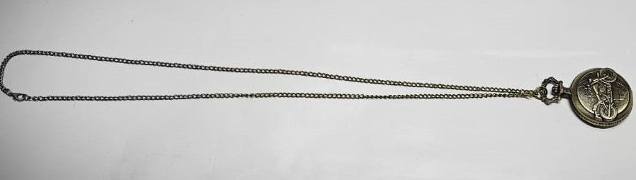 This brass pocket watch, a striking fusion of craftsmanship and legend, embodies the spirit of Ghost Rider with intricate details and a dark, enigmatic aura