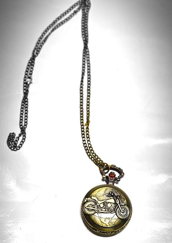 This brass pocket watch, a striking fusion of craftsmanship and legend, embodies the spirit of Ghost Rider with intricate details and a dark, enigmatic aura