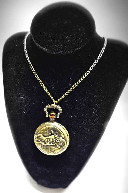 This brass pocket watch, a striking fusion of craftsmanship and legend, embodies the spirit of Ghost Rider with intricate details and a dark, enigmatic aura