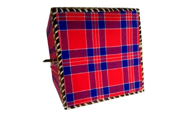 A rectangular gift box made from a Maasai shuka is a striking fusion of cultural tradition and functional elegance