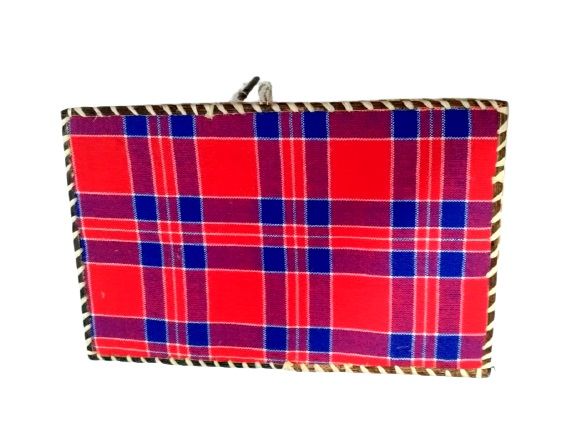 A rectangular gift box made from a Maasai shuka is a striking fusion of cultural tradition and functional elegance