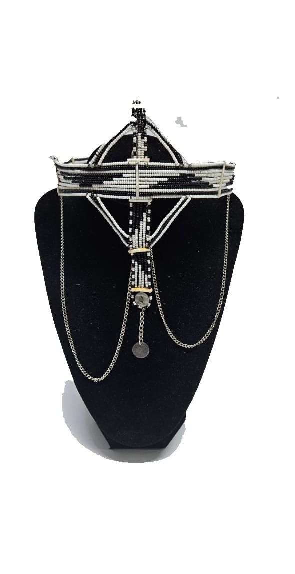 A black and white maasai head gear /face gear with silver decorations very classic and fashionable to have