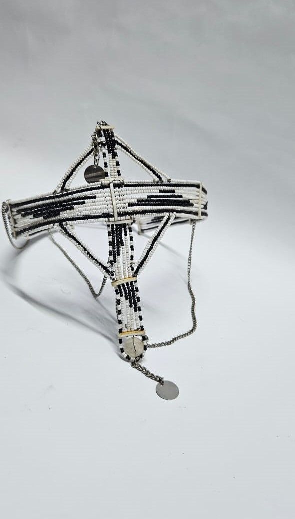 A black and white maasai head gear /face gear with silver decorations very classic and fashionable to have