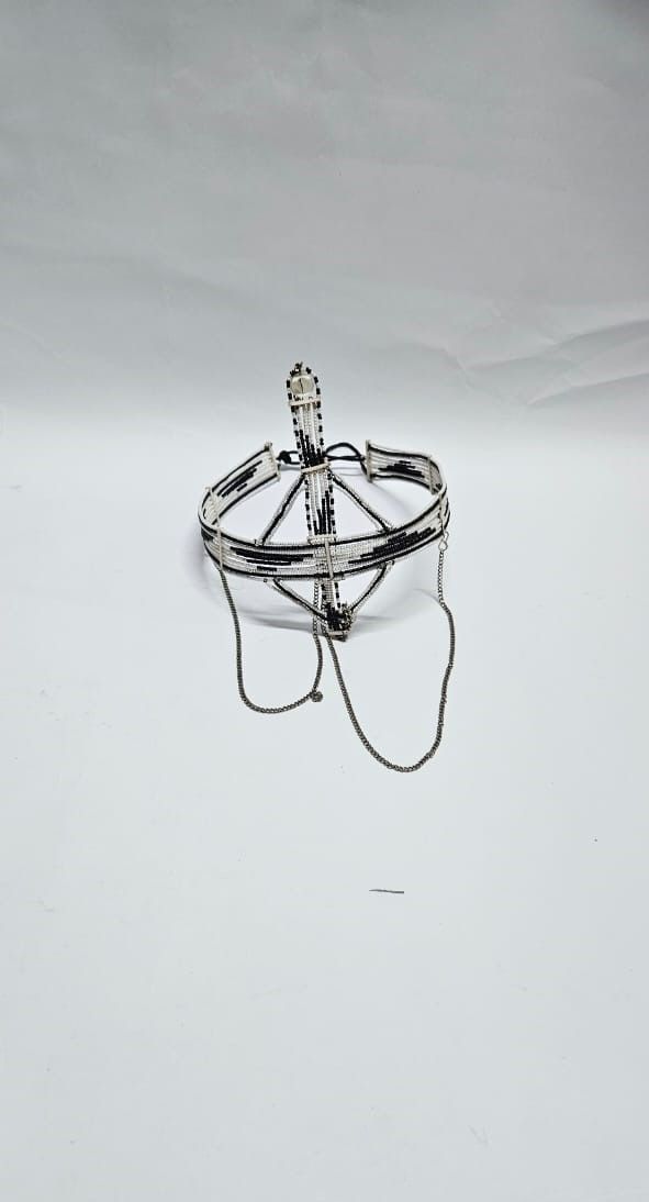 A black and white maasai head gear /face gear with silver decorations very classic and fashionable to have