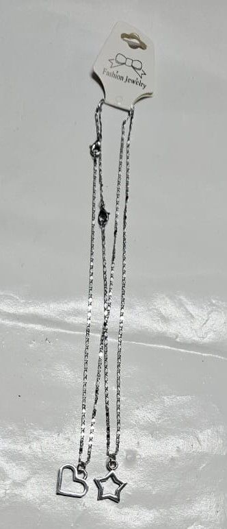 A double silver chain necklace of a love and star very fashionable and unique to have and is durable