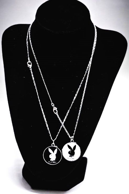 A couple silver chain necklace with a rabbit symbol very beautiful and fashionable to have and it is durable