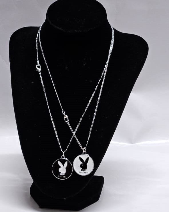 A couple silver chain necklace with a rabbit symbol very beautiful and fashionable to have and it is durable