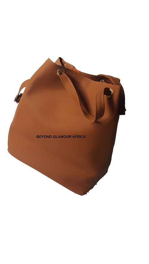 Women's brown leather Ankara handbag easy and comfortable to carry and is very fashionable to have are readily available with affordable prices