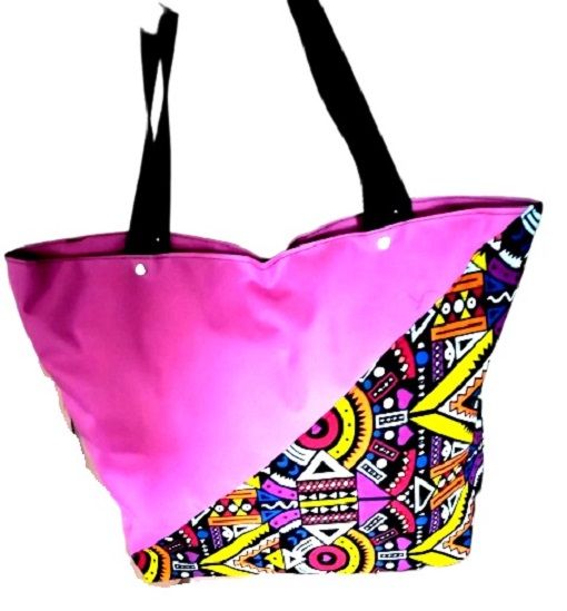 Women's pink canvas Ankara handbag easy and comfortable to carry and is very fashionable to have ,they are readily available.