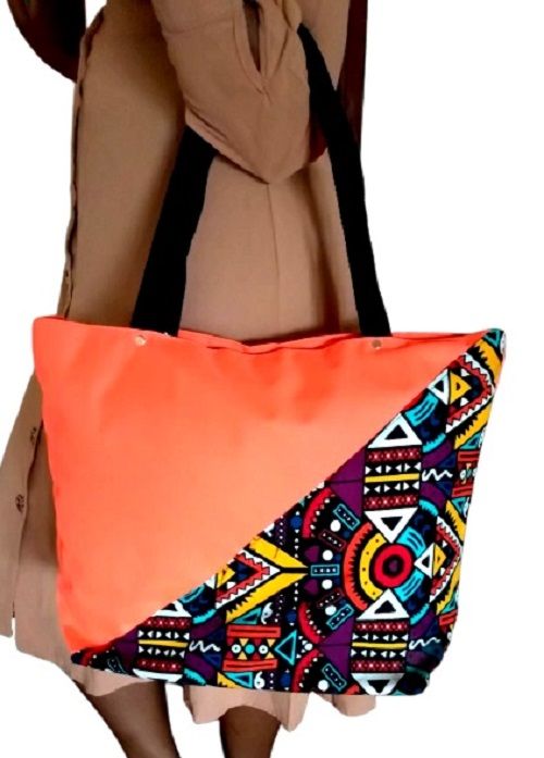 Women's orange canvas Ankara handbag easy and comfortable to carry and is very fashionable and classic to have