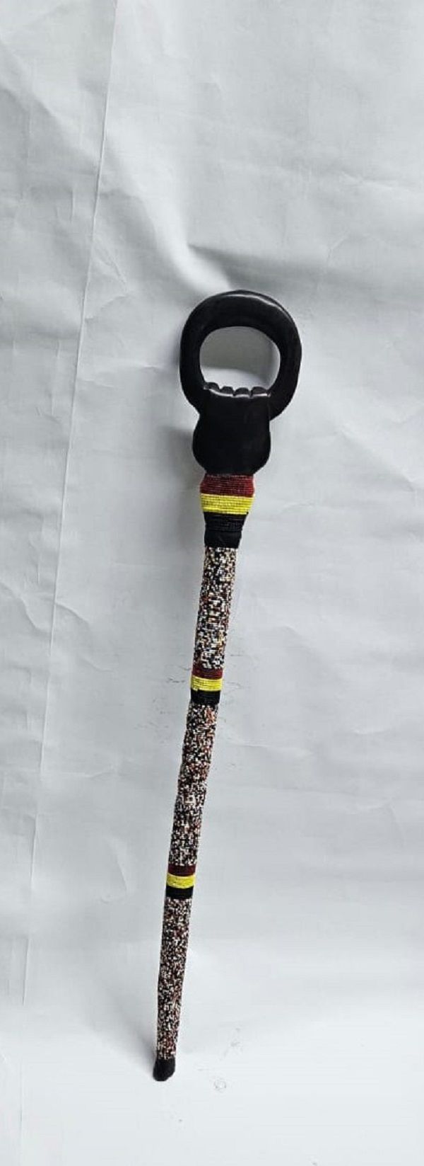 Men's wooden multi colored beaded walking stick easy and comfortable to carry and is very fashionable to have.