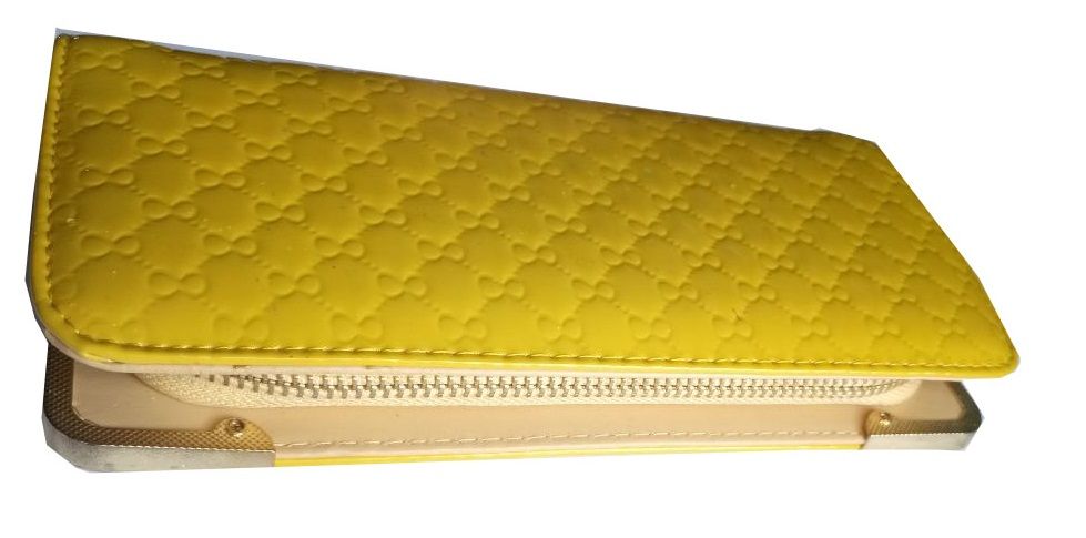 A multicolored knitted scarf and a ladies yellow purse combo very fashionable, durable and comfortable to have .