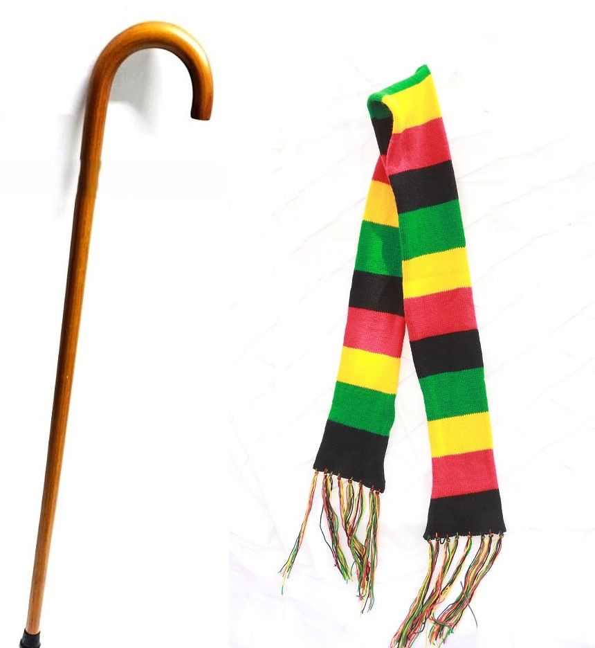 A brown number seven walking stick having a shock absorber and a knitted multicolored scarf combo fashionable to have