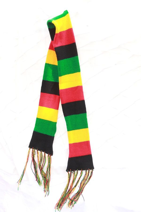 A brown number seven walking stick having a shock absorber and a knitted multicolored scarf combo fashionable to have