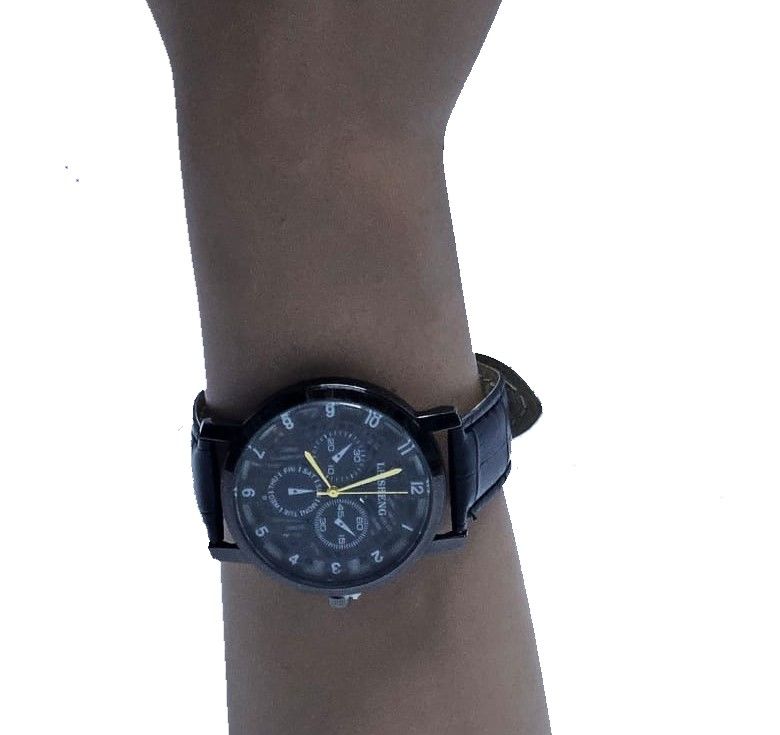 A black Ankara poncho and a black skeleton watch combo very fashionable, durable , and comfortable to have.