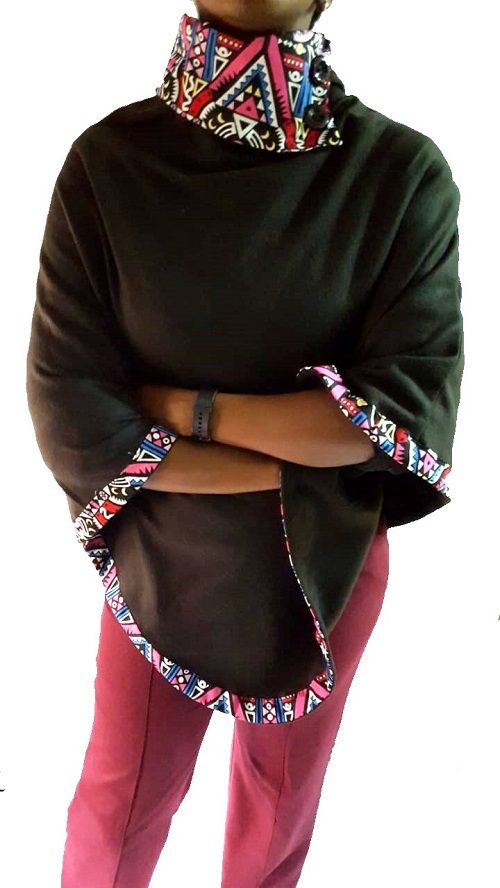 A black Ankara poncho and a black skeleton watch combo very fashionable, durable , and comfortable to have.