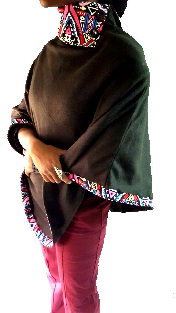 A black Ankara poncho and a black skeleton watch combo very fashionable, durable , and comfortable to have.