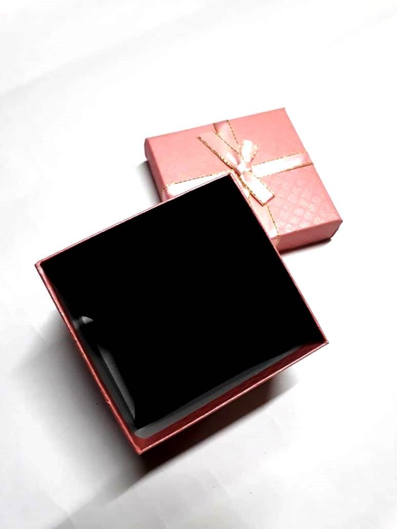 A pink card board gifting box very fashionable and durable to have. Used for putting gifts and surprises.