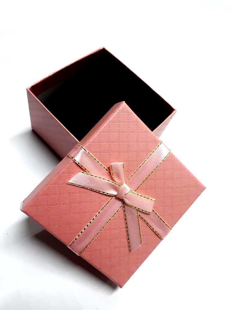 A pink card board gifting box very fashionable and durable to have. Used for putting gifts and surprises.