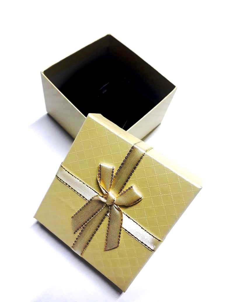 A golden yellowish gifting box best for presenting gifts and surprises and are very fashionable and durable