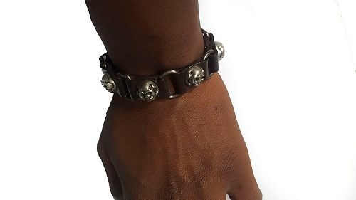 A dark brown skulls leather bracelet easy and comfortable to wear and is very fashionable and durable to have.