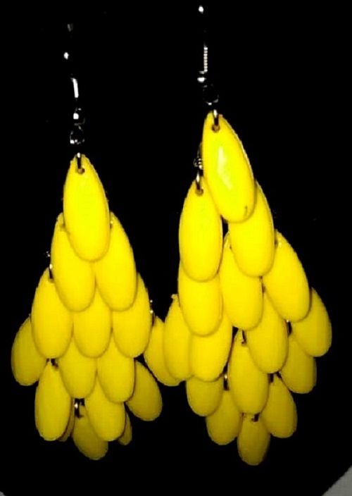 Ladies’ yellow African handcrafted sisal kyondo with leather straps and yellow crystal chandelier earrings combo very fashionable and durable .