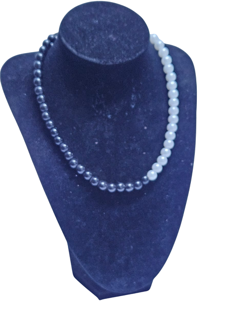 A black and white medium pearl necklace easy and comfortable to wear, durable ,fashionable and best gift to gift to your friends.