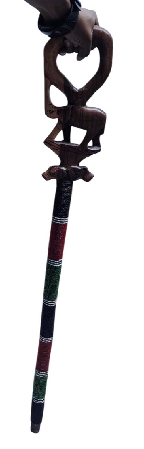 A brown Kenyan Maasai beaded walking stick featuring a lion and elephant design fashionable and durable to have.