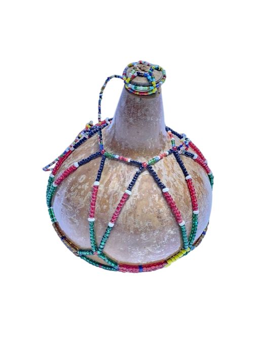A brown calabash having maasai beads best for home decoration and authentic African gift readily available.