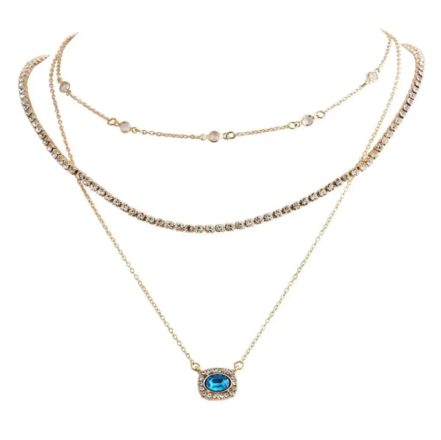 Elegant Multi-Layered Gold Necklace With Blue Gem Pendant. Designed To Enhance Any Outfit, This Piece Is Perfect For Formal Occasions, Casual Wear, Or As A Statement Accessory