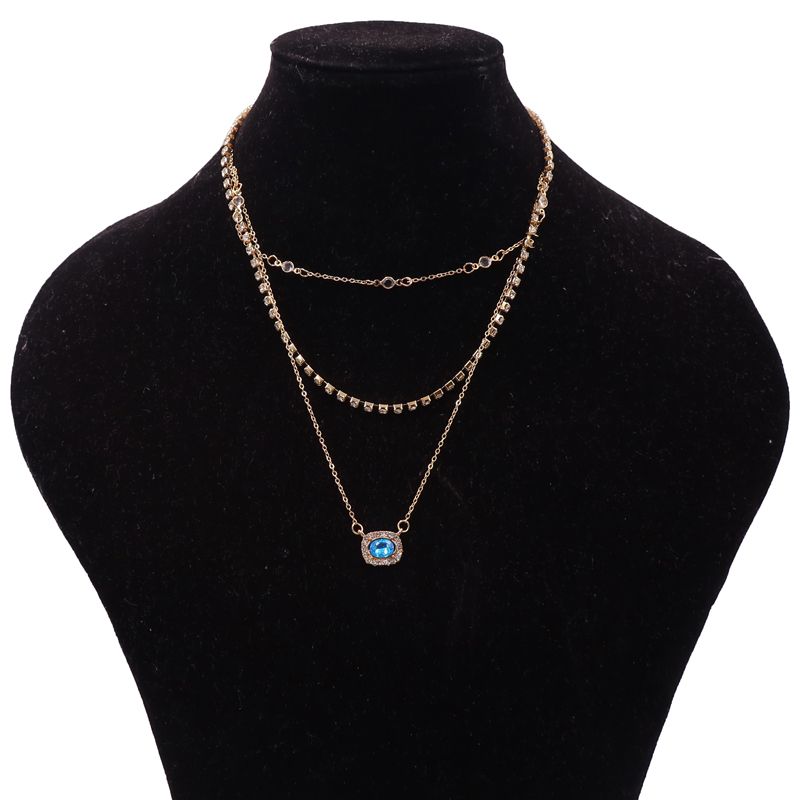 Elegant Multi-Layered Gold Necklace With Blue Gem Pendant. Designed To Enhance Any Outfit, This Piece Is Perfect For Formal Occasions, Casual Wear, Or As A Statement Accessory