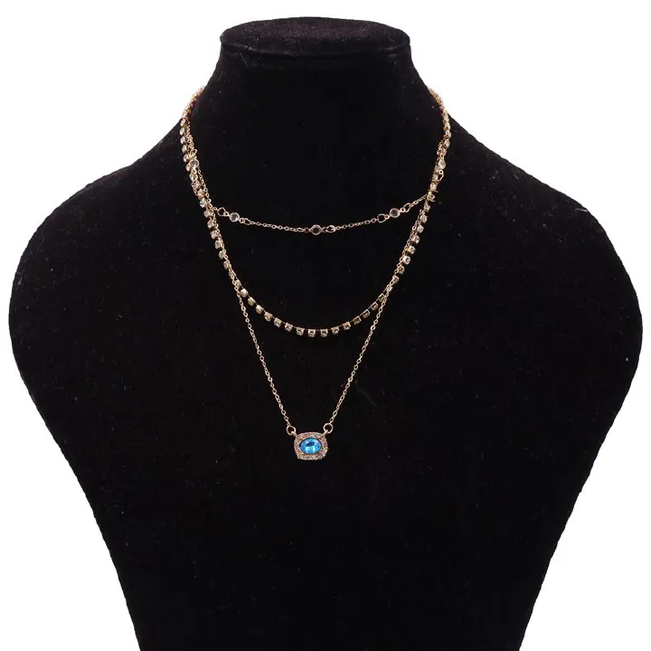 Elegant Multi-Layered Gold Necklace With Blue Gem Pendant. Designed To Enhance Any Outfit, This Piece Is Perfect For Formal Occasions, Casual Wear, Or As A Statement Accessory