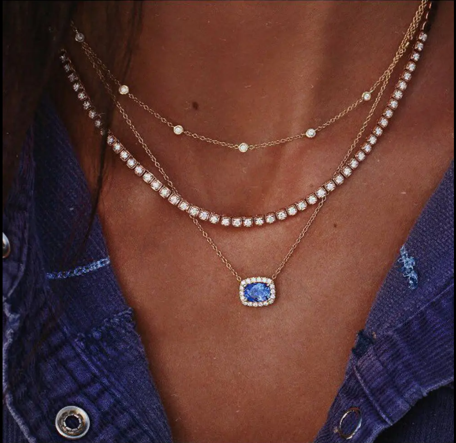 Elegant Multi-Layered Gold Necklace With Blue Gem Pendant. Designed To Enhance Any Outfit, This Piece Is Perfect For Formal Occasions, Casual Wear, Or As A Statement Accessory