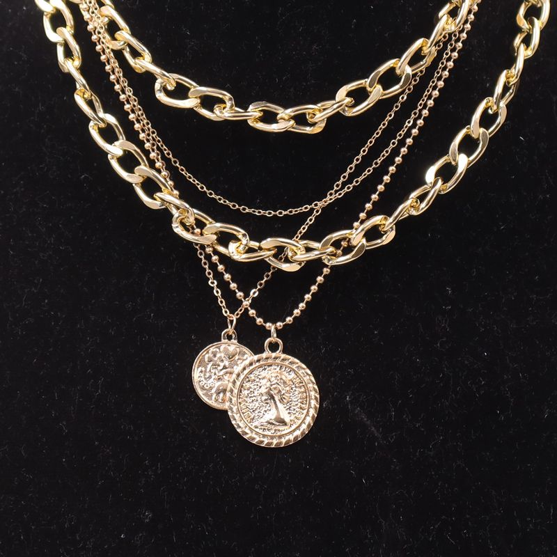 Bold & Trendy Gold Layered Chain Necklace With Coin Pendants. Make A Fashion Statement With This Gorgeous Layered Gold Necklace! Featuring A Mix Of Chunky Chains And Delicate Layers
