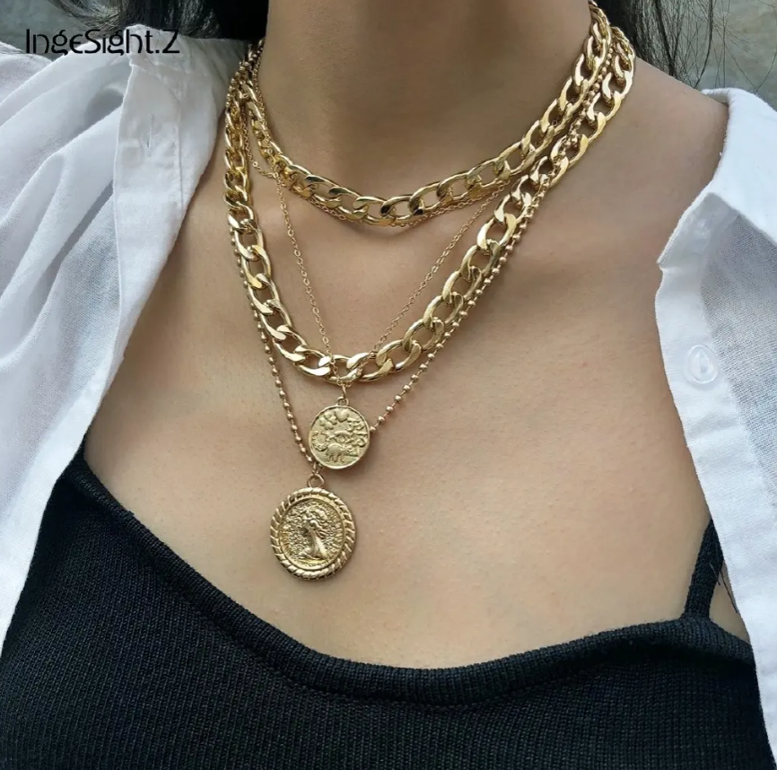 Bold & Trendy Gold Layered Chain Necklace With Coin Pendants. Make A Fashion Statement With This Gorgeous Layered Gold Necklace! Featuring A Mix Of Chunky Chains And Delicate Layers