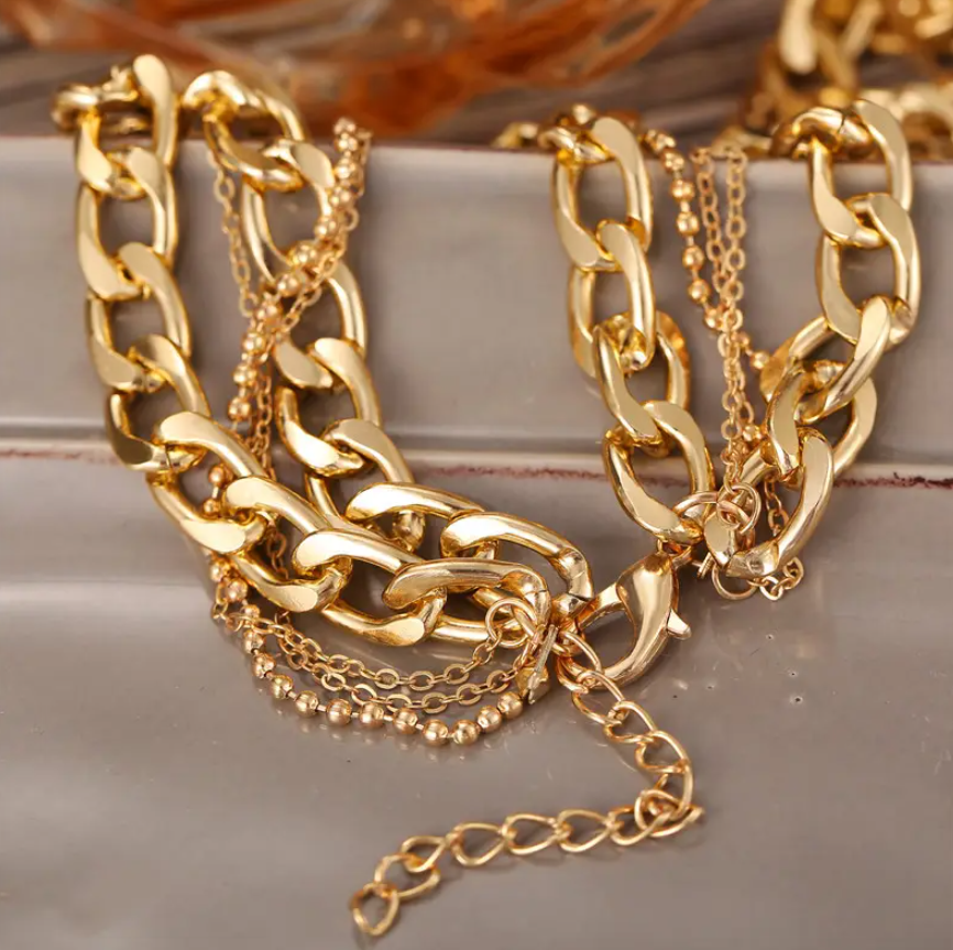 Bold & Trendy Gold Layered Chain Necklace With Coin Pendants. Make A Fashion Statement With This Gorgeous Layered Gold Necklace! Featuring A Mix Of Chunky Chains And Delicate Layers