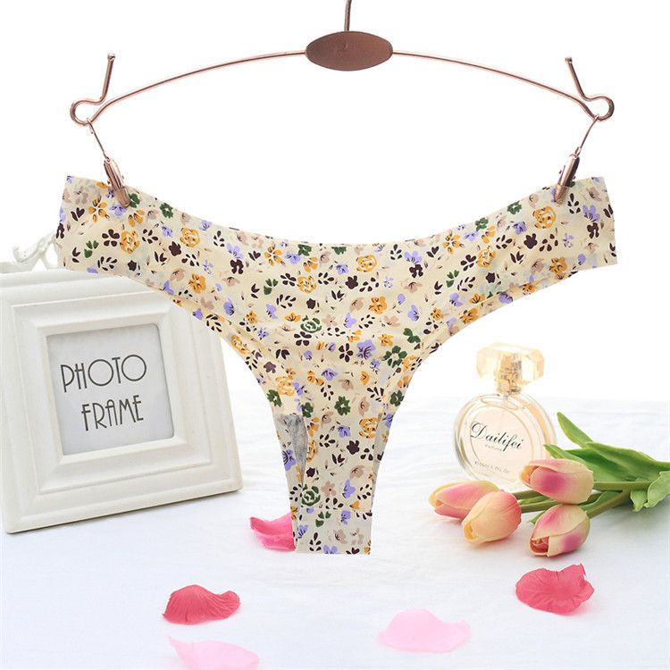 Women's one-piece printed seamless adhesive underwear sexy little fresh style low-waisted ice silk thong