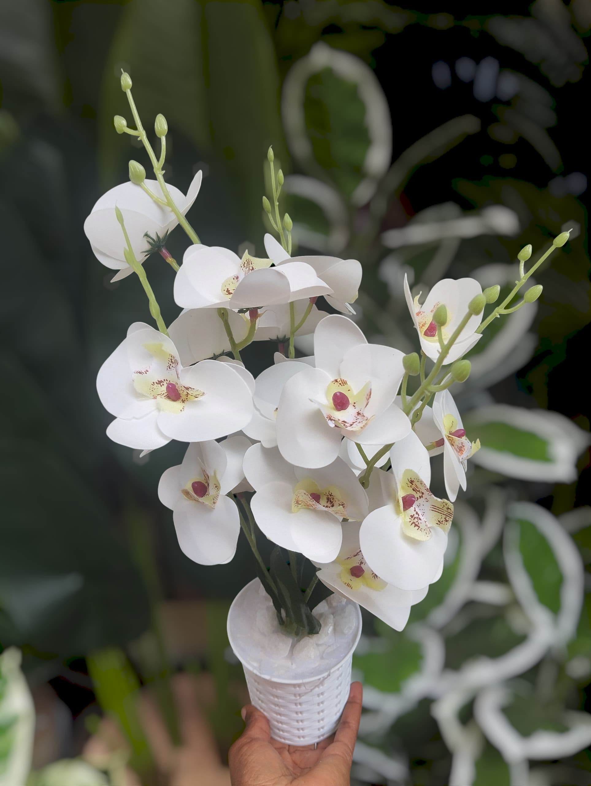 Artificial Orchid Flower Plant on a  Modern White  Vase/ Pot/ Planter covered with white pebbles