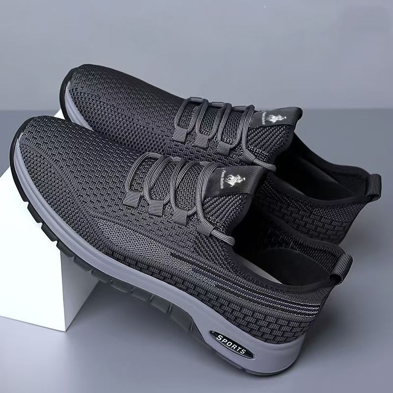 Running shoes with fly woven mesh surface, breathable and lightweight casual shoes, simple black, fashionable and trendy sports shoes.