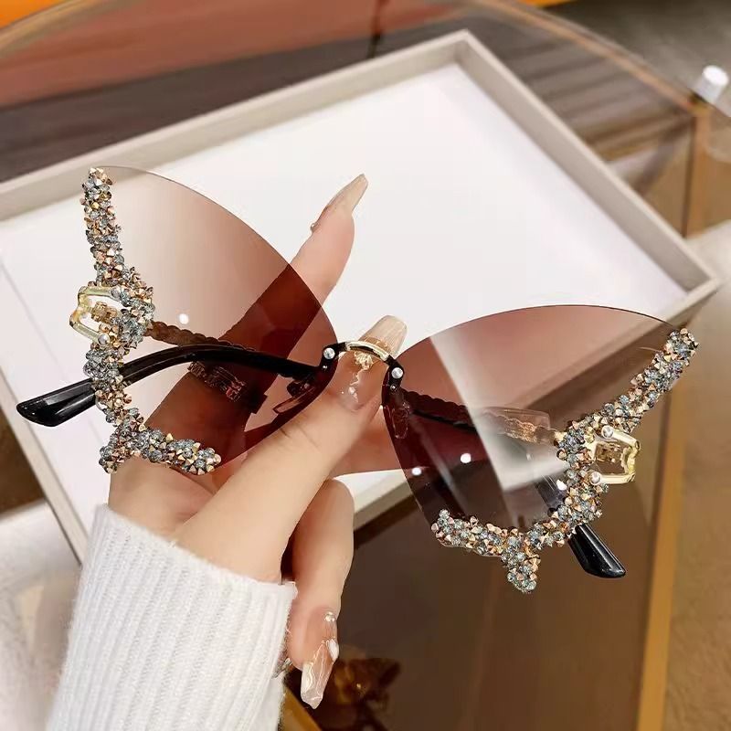 New arrivals women's butterfly shape diamond rimless sunglasses ladies' fashion personality exaggerated sunglasses girls sunglasses