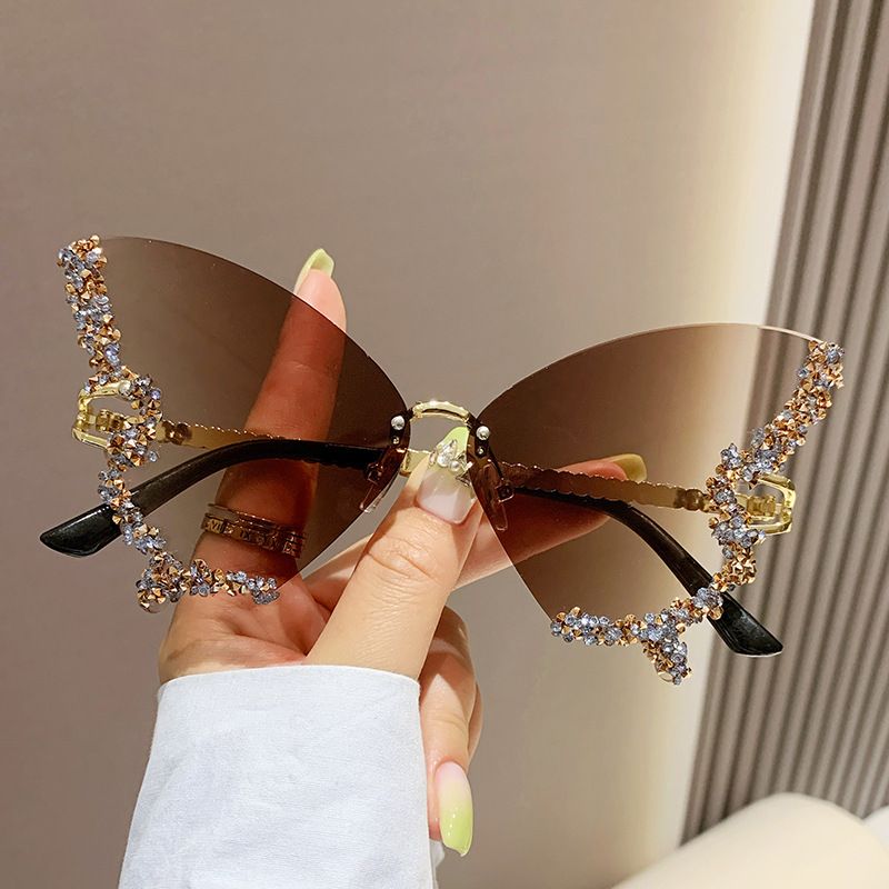 New arrivals women's butterfly shape diamond rimless sunglasses ladies' fashion personality exaggerated sunglasses girls sunglasses