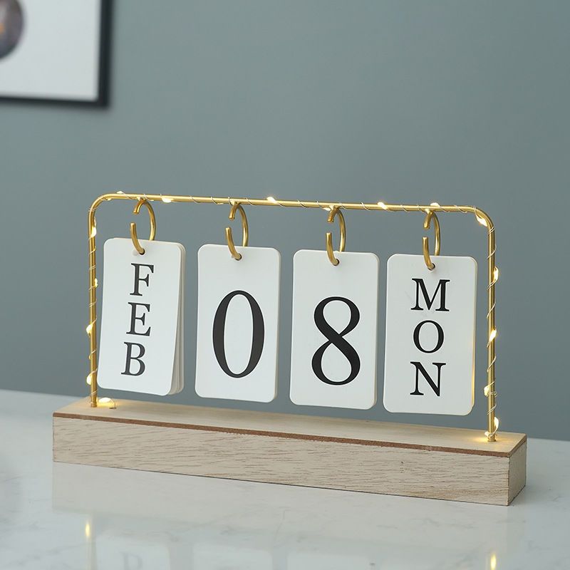 Metallic desktop home/office calendar with light...Uses 2 AA batteries to light[not included]