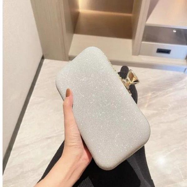 Socialites Lined Up For A Party, Wearing Diamond-Encrusted Evening Gowns And Carrying Evening Bags