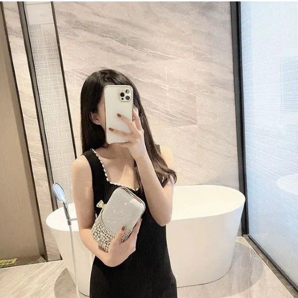 Socialites Lined Up For A Party, Wearing Diamond-Encrusted Evening Gowns And Carrying Evening Bags