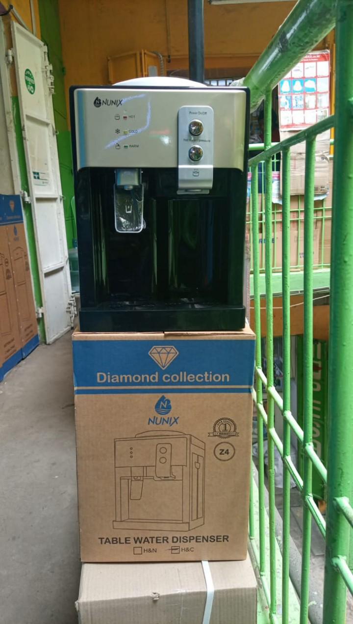 Z4C Nunix Hot And Cold Table Top Water Dispenser Hot Tank Capacity 0.7L Cold Tank Capacity 0.6L Easy To Use Press Taps Hot & Cold Water Power Switch Power Protection Fuse Stainless Steel Hot Water Tan
