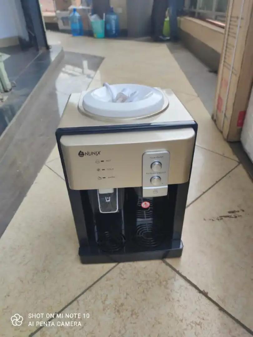 Nunix Classic Z4 Table Top Hot And Normal Water Dispenser  Hot Tank Capacity 0.7L Cold Tank Capacity 0.6L Easy To Use Press Taps Hot or normal water. Z4 nunix water dispenser