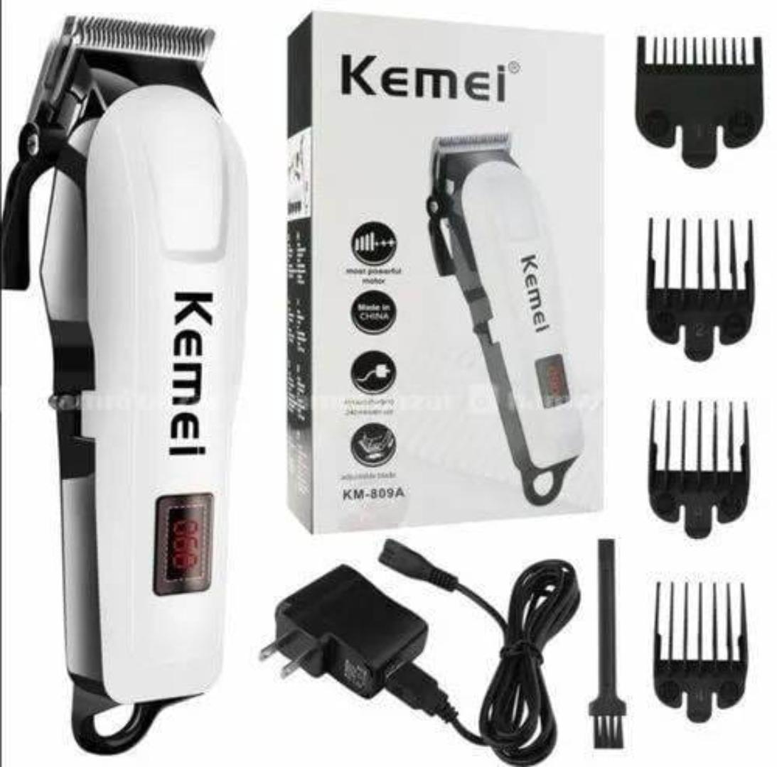 Kemei rechargeable cordless hair shaver kinyozi with led display and 4hrs continous shaving time battery power . Kemei cordless hair clipper shaving machine