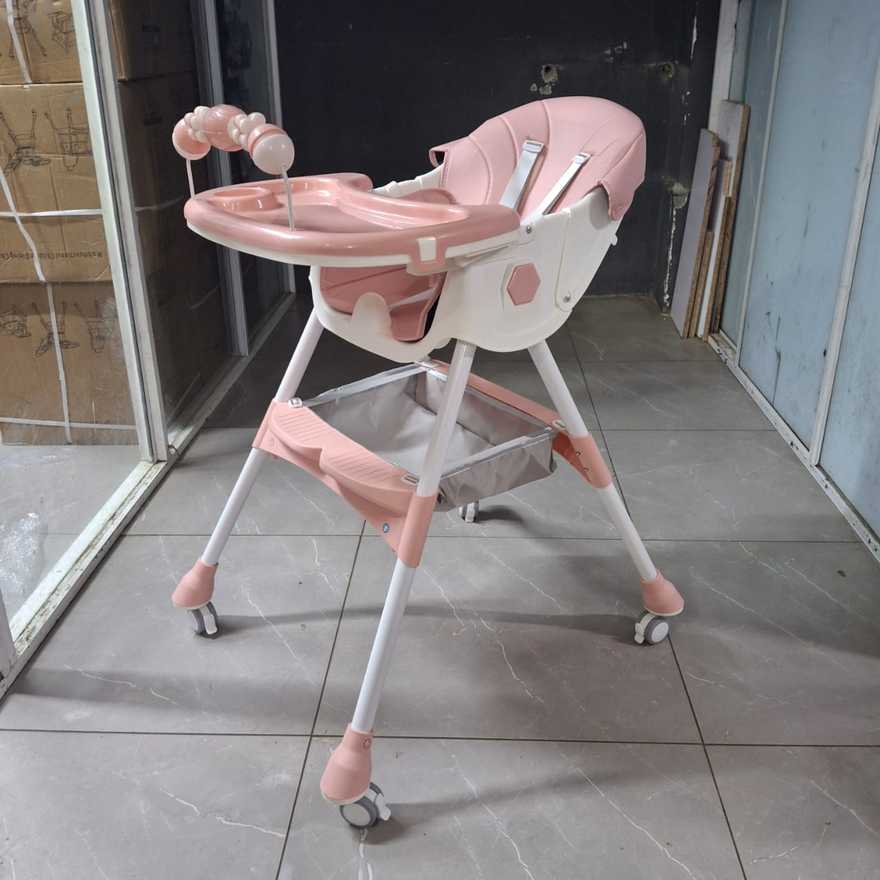 1pc Quality Feeding chair 
Has a reclining seat
It's foldable
Has wheels
Has a toy part