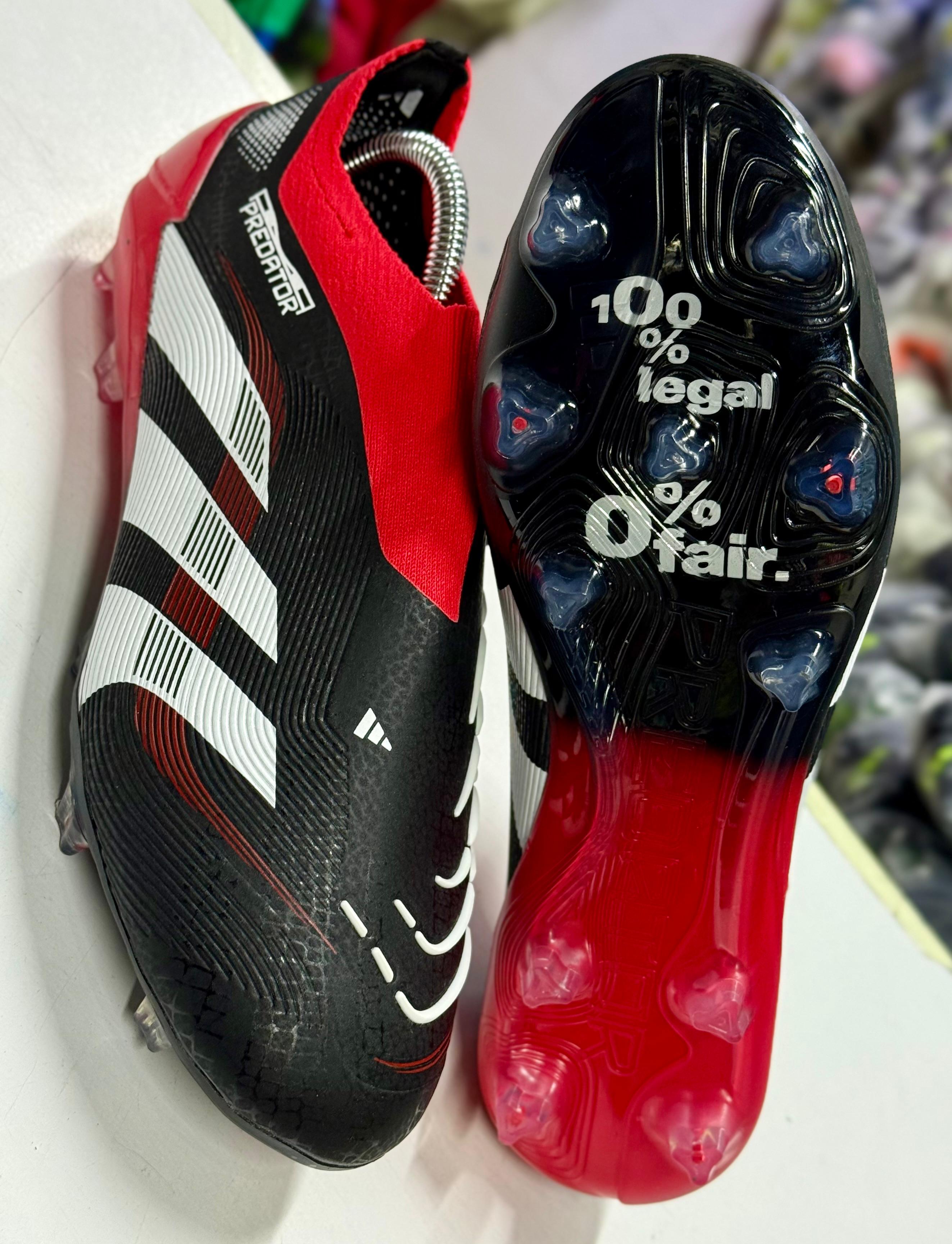 Predator Accuracy football boots, known for their rubber elements designed to enhance ball spin and control.